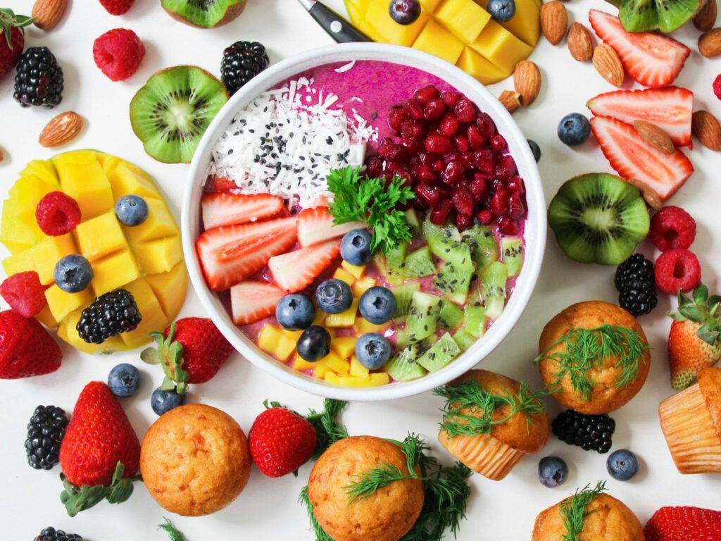 Flat lay of healthy food, journal, and wellness planner symbolizing holistic health and wellness lifestyle